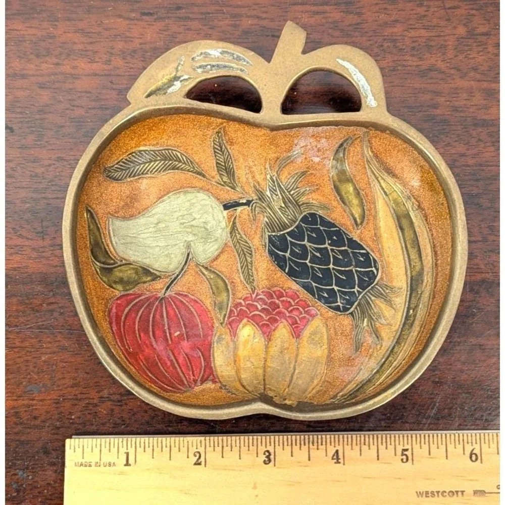 Vintage enameled brass apple-shaped trinket dish, often used for jewelry, keys